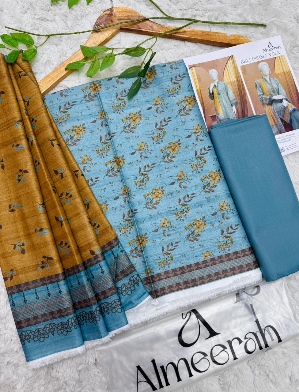 Almeera Bellissima Vol 2 unstitched printed lawn 3 piece suit in sky blue with mustard dupatta and dyed trouser available at Aladeen Fabrics