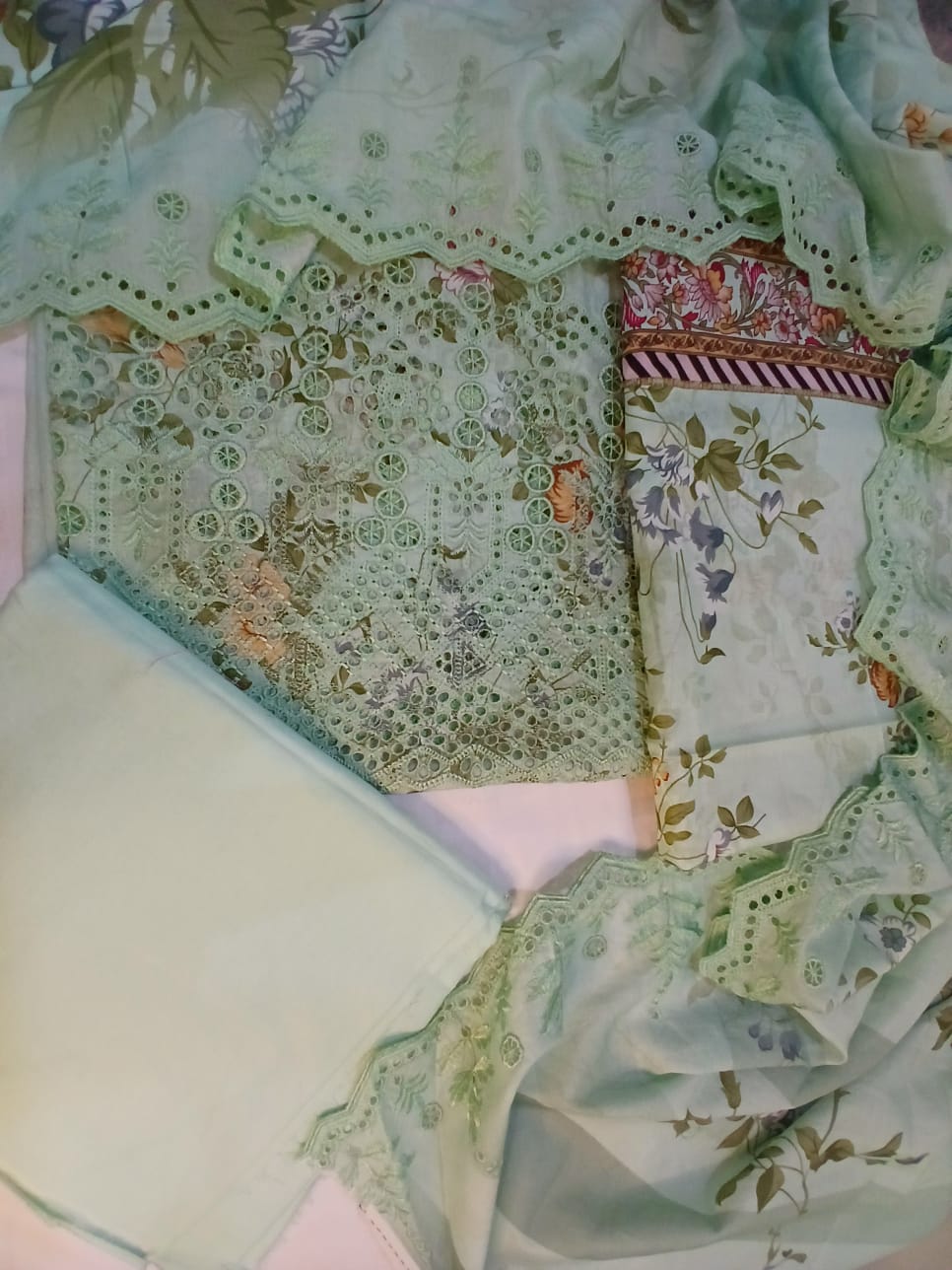 Detailed embroidery and cutwork design on premium pastel green lawn fabric shirt