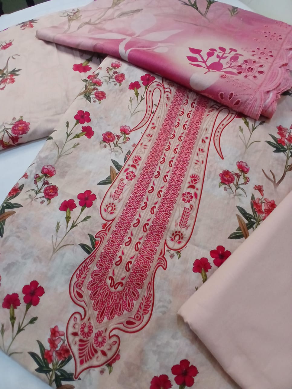 Full outfit view of luxury pink embroidered lawn suit with cutwork dupatta styled for summer casual and semi-formal wear