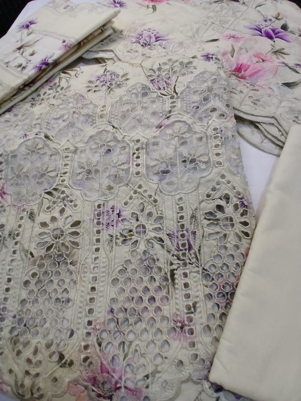 Lightweight lawn dupatta with digital floral print in pink and purple tones and elegant cutwork embroidered border