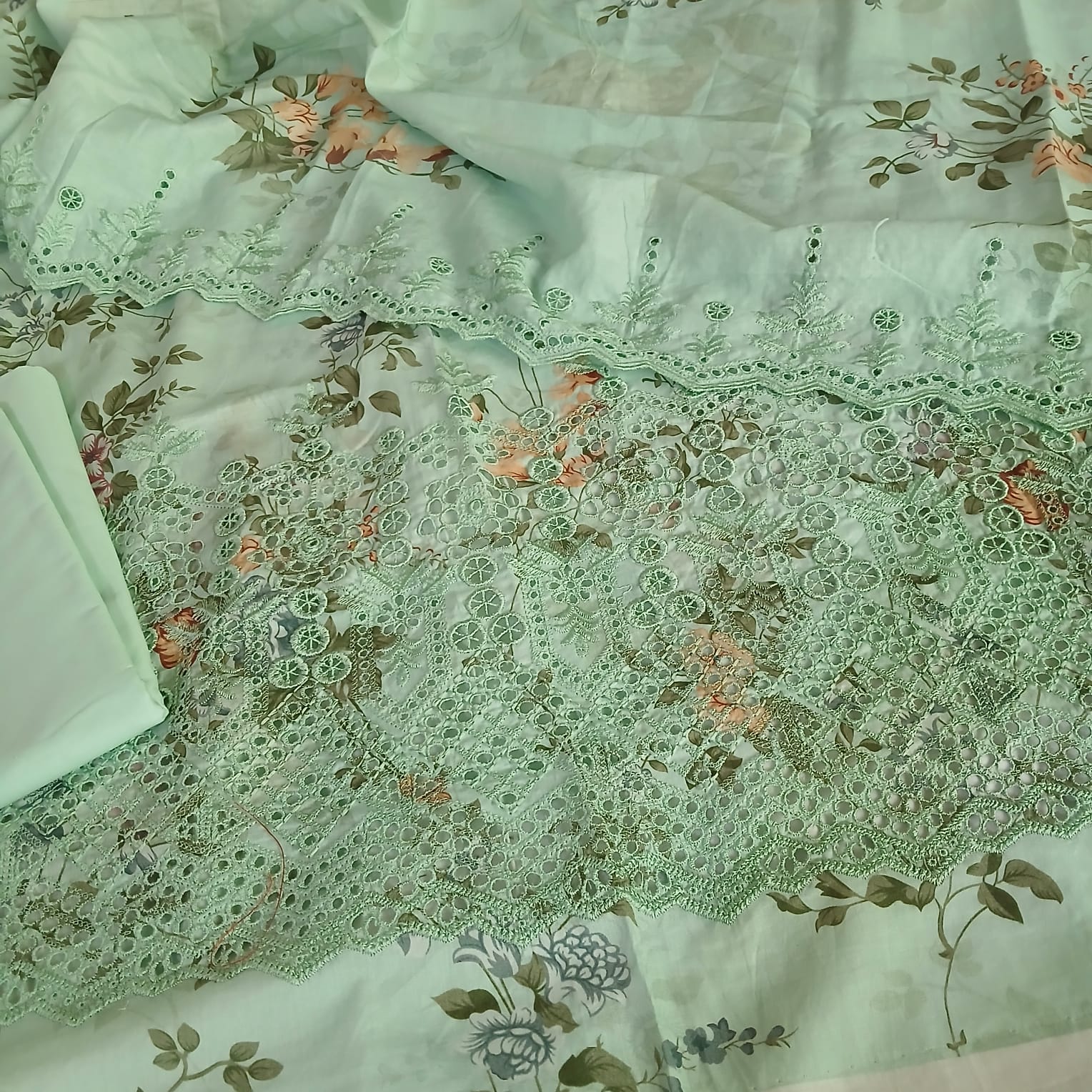 Pastel green lawn suit with full front embroidery and cutwork detailing premium summer wear design