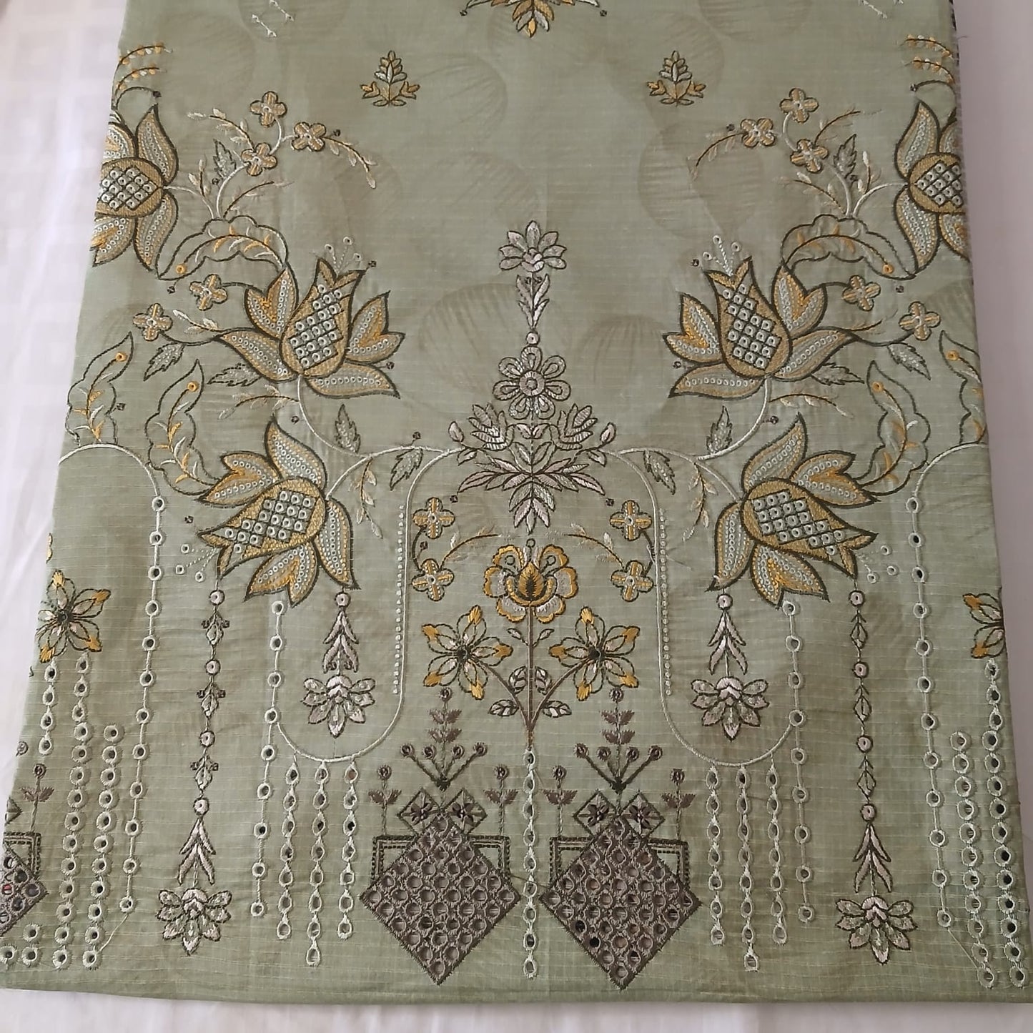 close detailed view of soft breathable pista green doria lawn fabric material