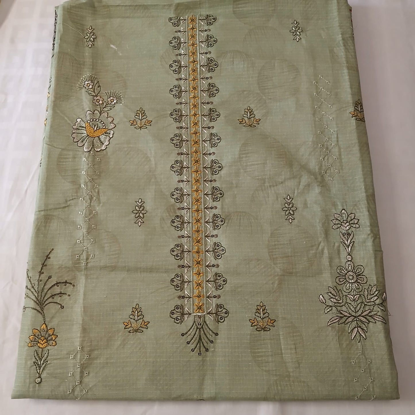 woman wearing pista green embroidered doria lawn 3 piece suit styled for summer